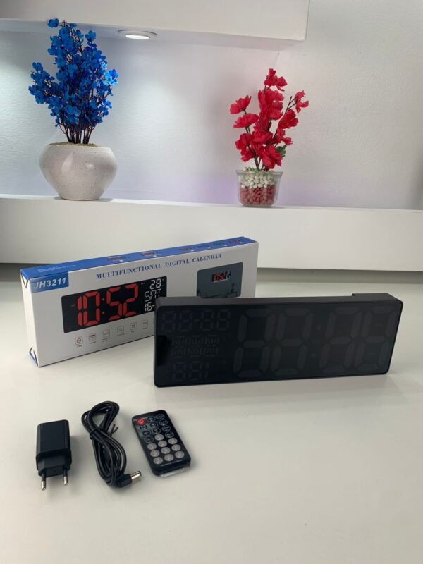 ⁦Horloge LED Moderne avec Éclairage Multicolore et Design Élégant⁩ - الصورة ⁦2⁩